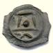A stone with a face carved into it

Description automatically generated with low confidence