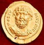 A coin with a person's face on it

Description automatically generated with medium confidence