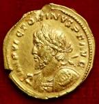 A gold coin with a lion on it

Description automatically generated with low confidence